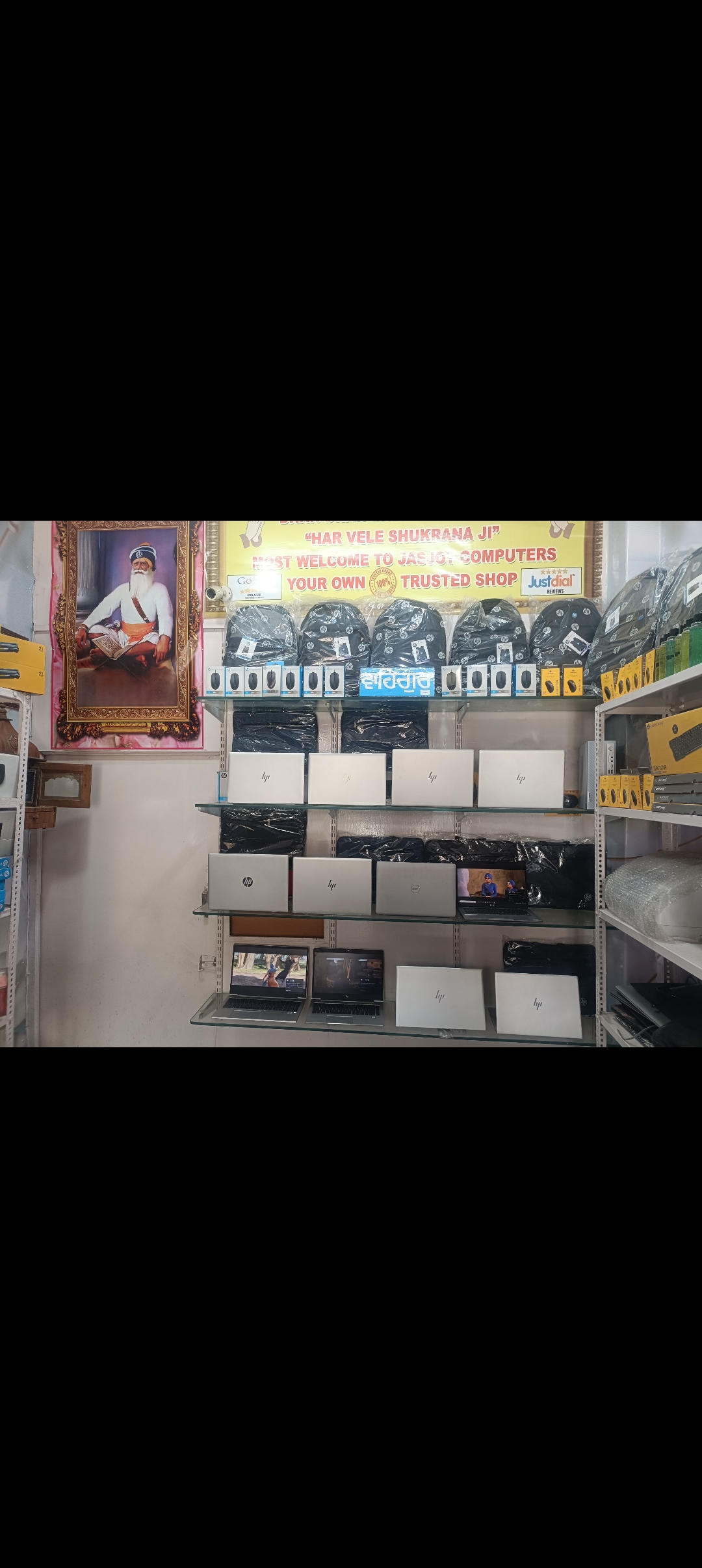 Laptop display and store interior at Jasjot Computers